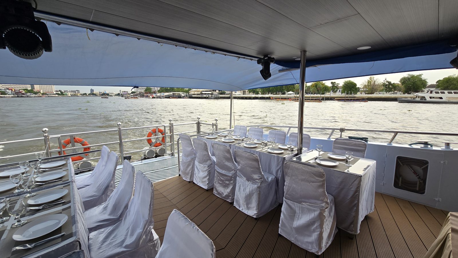 Tables arranged for a wedding or family gathering on the covered deck